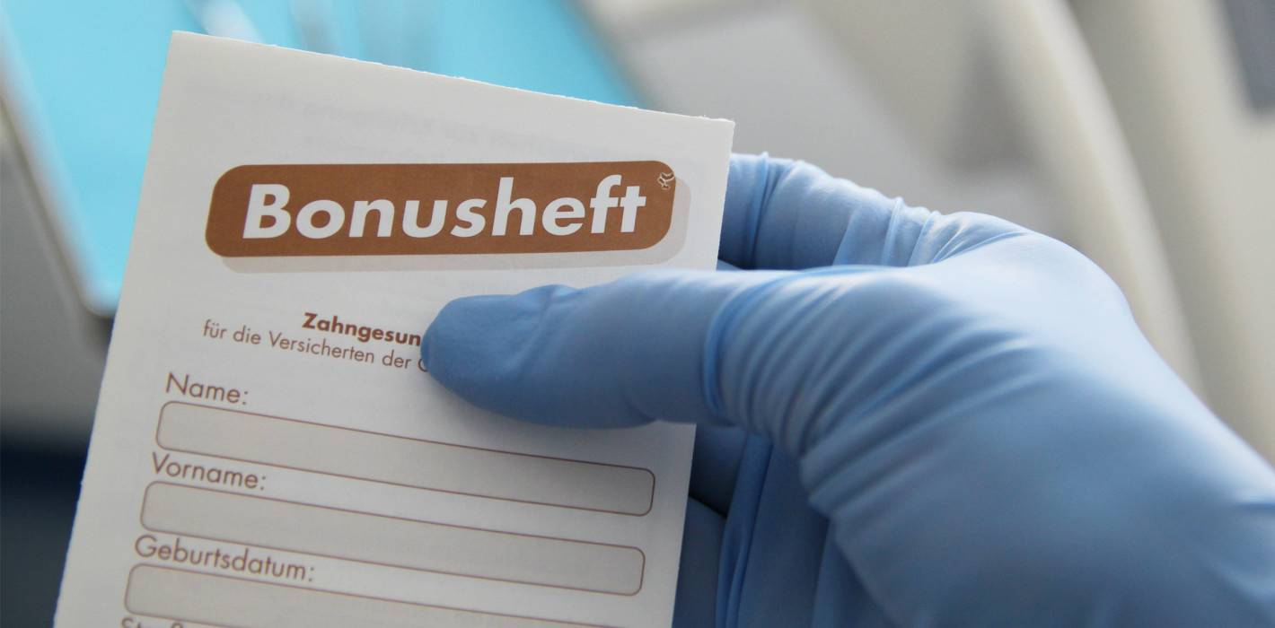Bonusheft: Mehr Geld von der Krankenkasse für Zahnersatz